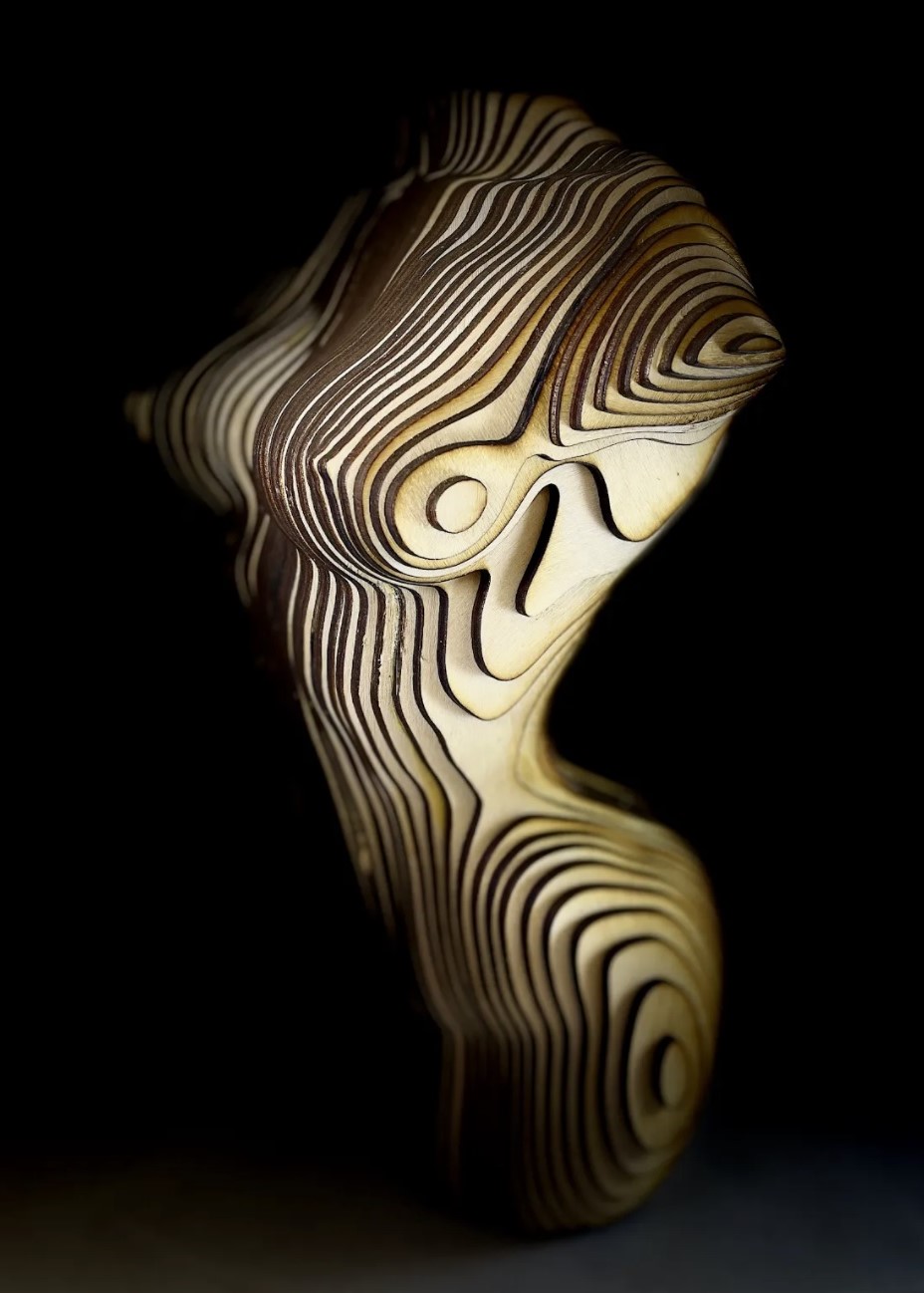 Laser cut sculpture of a woman.