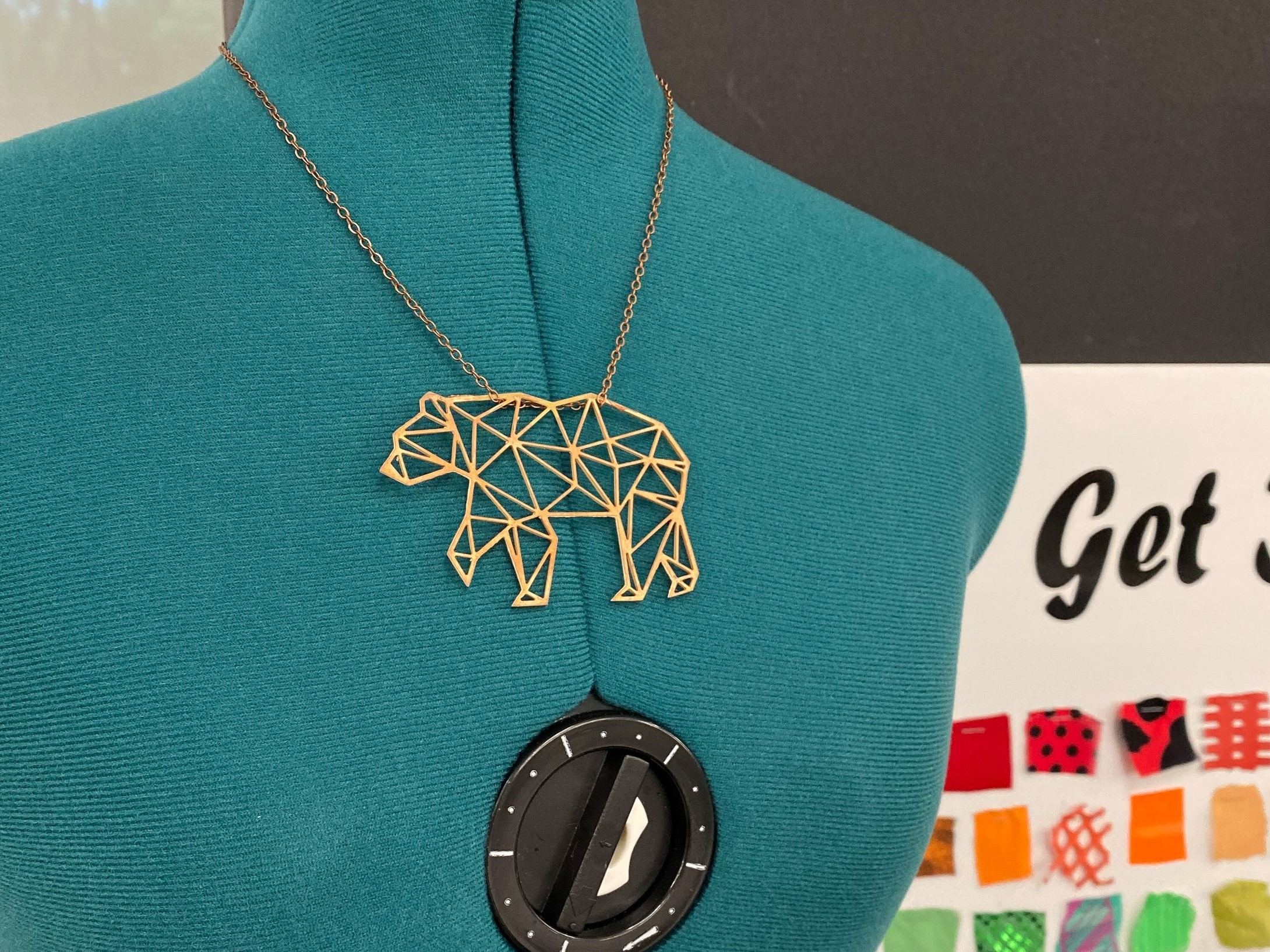 Necklace of a geometric bear